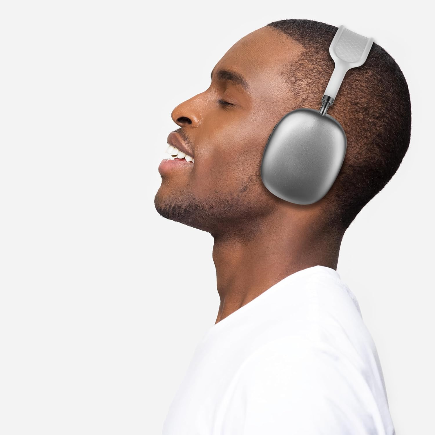 A man enjoying music with wireless over-ear headphones, showcasing premium sound quality.